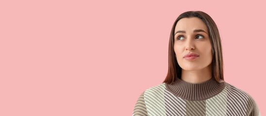 Thoughtful young woman on pink background with space for text