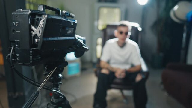 Arrogance and narcissism self-confident rap artist reading rap to camera. Portrait of handsome caucasian hip-hop singer recording musical video or content for social media, tattoos on face and body