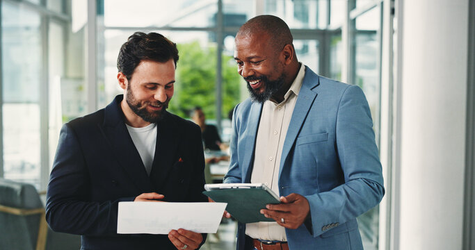 Financial advisor, tablet and men with documents, discussion and email for investment deal. People, investors and employees in office, tech and teamwork with checklist for trading portfolio and app