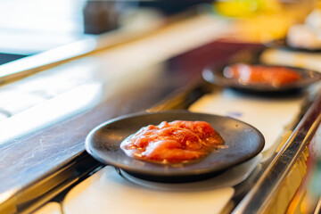 Food on a conveyor belt in a restaurant