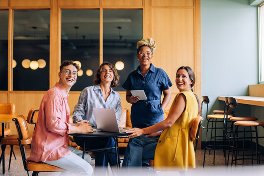 Smiling team at a meeting in a modern office space