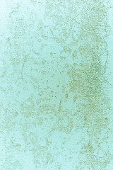 Textured blue surface with subtle patterns and uneven tones creating an intriguing visual effect