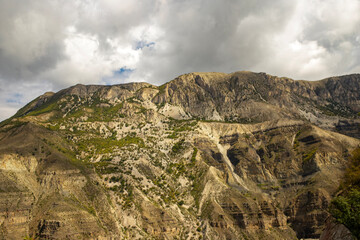 View of a mountain against a cloudy sky. Landscape in Dagestan region, Russia. Picturesque view. Trekking, hiking, camping 