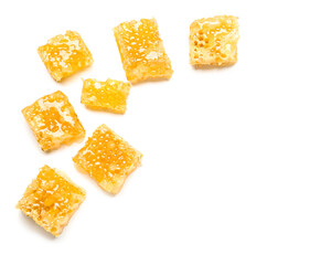 Many sweet honeycombs on white background