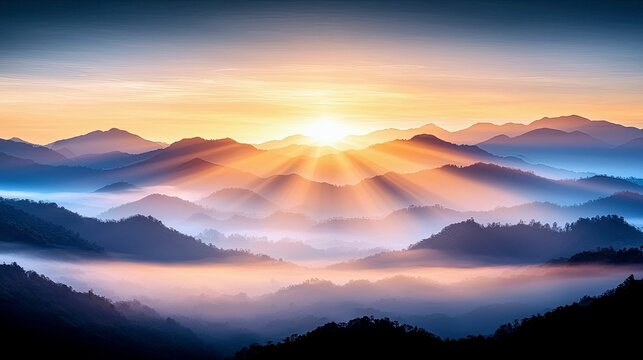 A serene sunrise illuminates layers of misty mountains with golden rays, creating a tranquil and majestic natural landscape.