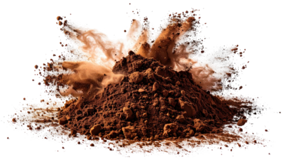 Cocoa powder erupts against black background