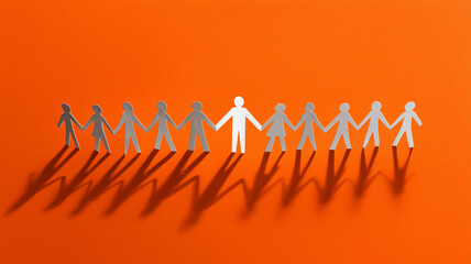 A line of paper people holding hands, with one person standing out in white on an orange background. Ai generated
