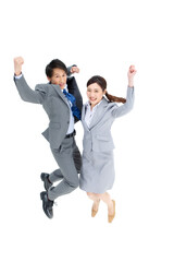 ジャンプするビジネスマンとビジネスウーマン
