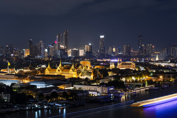 Top view of The Grand Palace, Chakri Maha Prasat Throne Hall and The Emerald Buddha Temple at night time.
