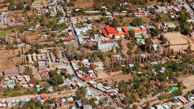 Bird's eye view of the village of Pisco Elqui with the warm colors of northern Chile, arid surroundings on a sunny day. Northern village of Pisco