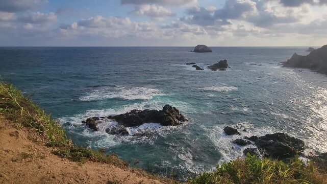 Waves crashing on a cliff in Zipolite, Mexico