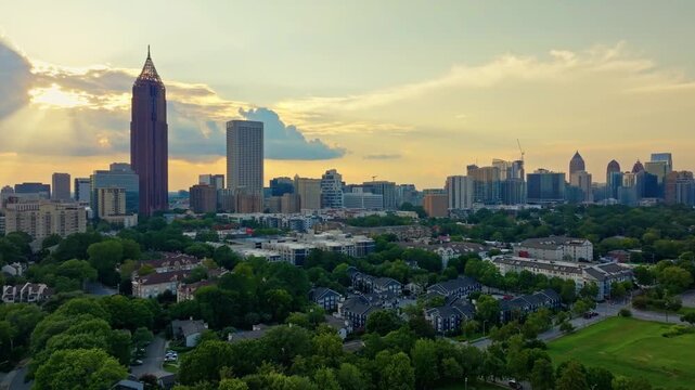 Atlanta city skylines and greenery at sunset, Revealing drone shot