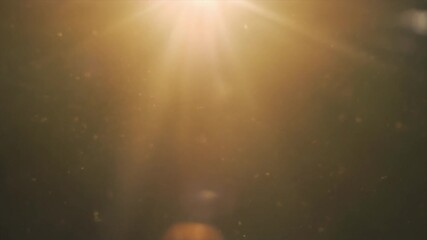 A warm, golden light beam shines down through a dusty atmosphere, creating a beautiful lens flare effect. - Powered by Adobe