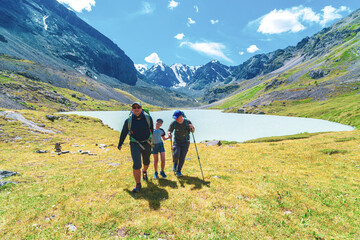 father and two sons trek in the mountains