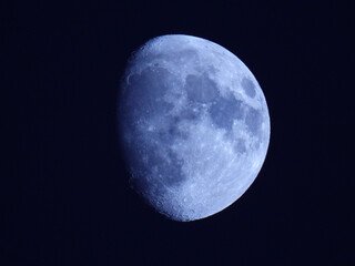 moon in waxing gibbous phase in the dark sky