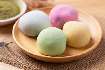 Daifuku mochi (Traditional Japanese sweet) on wooden plate