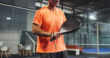 Padel, sports and hands of man ready for game, tournament and competition on indoor court. Tennis,...