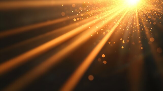 Golden light shining diagonally with lens flare effect on a dark background, creating a captivating visual effect