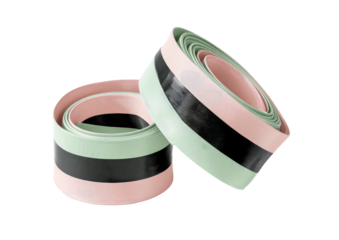 Two rolls of striped bar tape, pastel palette