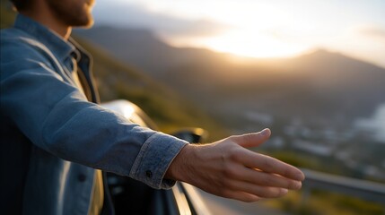 Man’s arm reaching out of a car window into the sunset breeze — concept of freedom, travel inspiration, and emotional connection to the open road. cinematic color correction, natural uneven