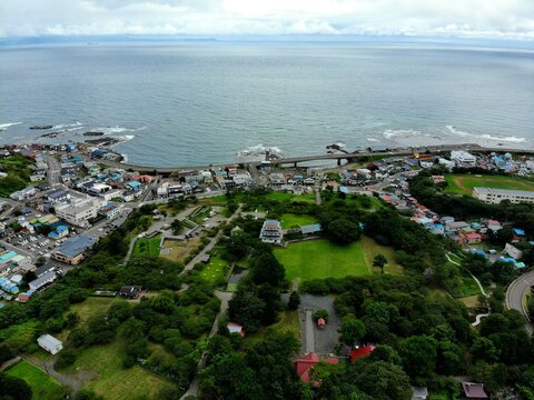 Aerial of Matsumae Castle Park and coastal town in Hokkaido, Japan, overlooking the Tsugaru Strait