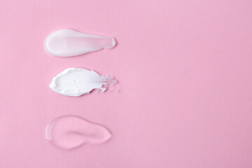 Samples of cosmetic products on pink background, flat lay. Space for text