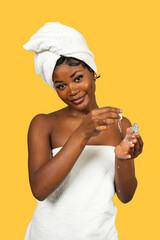 Young woman applying face serum for skincare routine