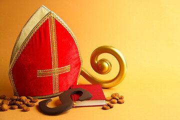 Sinterklaas (Saint Nicholas) Day. Chocolate letter S, kruidnoten cookies, mitre, crosier and...