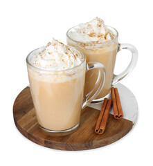 Tasty pumpkin latte with whipped cream in glass cups and cinnamon isolated on white