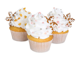 Tasty cupcakes with Christmas decor isolated on white