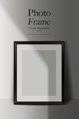 Black vertical photo frame mockup leaning on a wall. Realistic shadow and light effect.