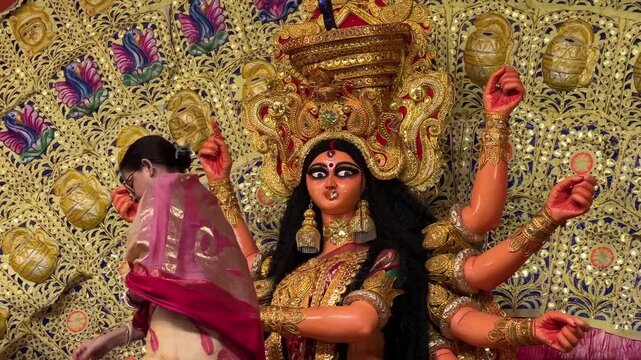 An Indian woman offering bhog to Durga Maa during last day of Vijaya Dashami in Kolkata
