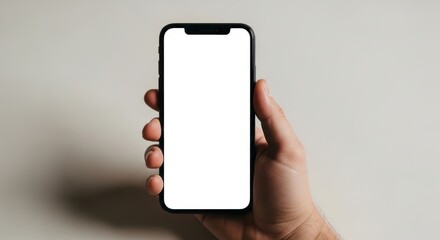 Hand holding a smartphone with a blank screen