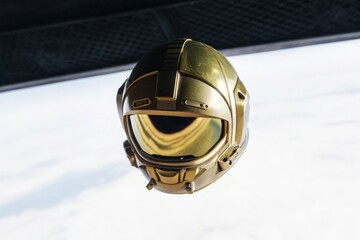 a helmet is hanging from a ceiling