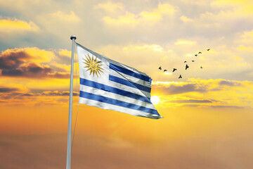 Uruguay flag waving in sunset or sunrise. Uruguay flag for Republic Day and Independence Day.