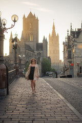 Stylish mature woman strolling around the city in a beige coat