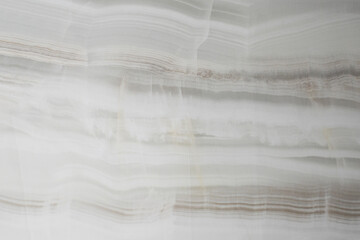 Light marble background with brown streaks. Porcelain stoneware for interior renovation. Smooth surface.Granite tiles.