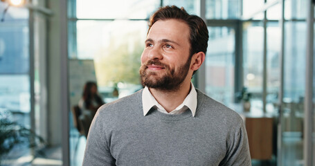 Thinking, smile and business man in office for planning, reflection and brainstorming. Happy, insight and problem solving solution with male person in agency for perspective, vision and memory