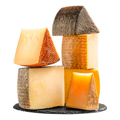 Assorted pieces of Spanish cheese stacked on slate plate isolated, traditional Manchego and aged sheep cheeses with rustic rind, gourmet dairy food concept advertising or banner.