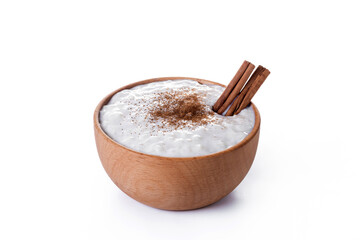 Rice pudding on wooden bowl isolated on white background