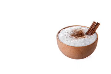 Rice pudding on wooden bowl isolated on white background. Copy space