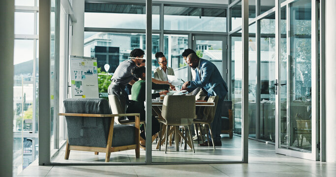 Business people, meeting and discussion with documents for analytics, performance or statistics. Group, employees or conversation with paperwork for corporate analysis, review or data in workplace