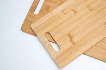 Two Bamboo Cutting Boards with Handles on White