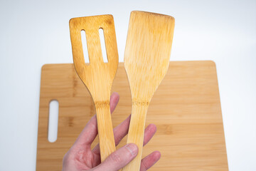 Bamboo Cutting Board with Spatulas on White Background