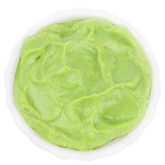 Bowl of creamy avocado puree isolated, fresh green guacamole sauce, healthy organic food concept