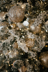 Elegant Christmas Tree with Ornaments and Snowy Branches