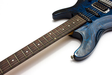 Fototapeta premium A vibrant blue electric guitar isolated on white background. 