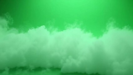 A green screen background with white clouds floating in the middle distance view
