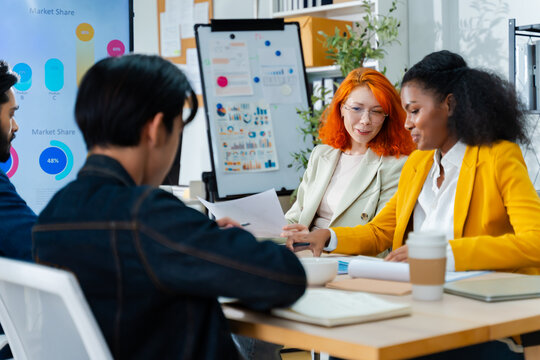 Group of Multiracial creative business brain storm meeting presentation,discussing roadmap to product launch, planning,strategy,new business development,working with new startup project in office.