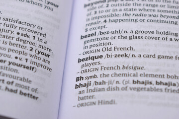 Obraz premium Close Up Of English Dictionary Page With Word - bezique